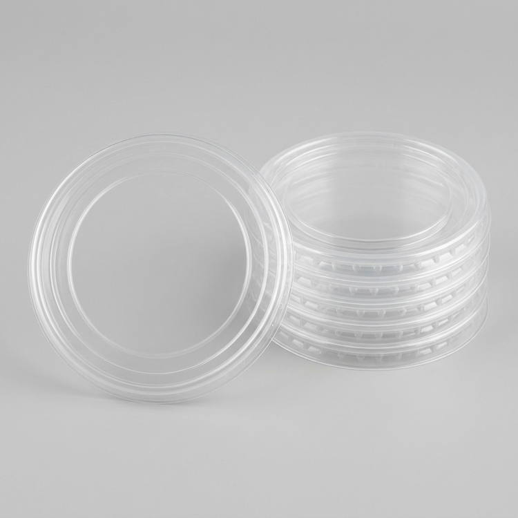 Generated illustration of clear portion-cup lids, cups not included